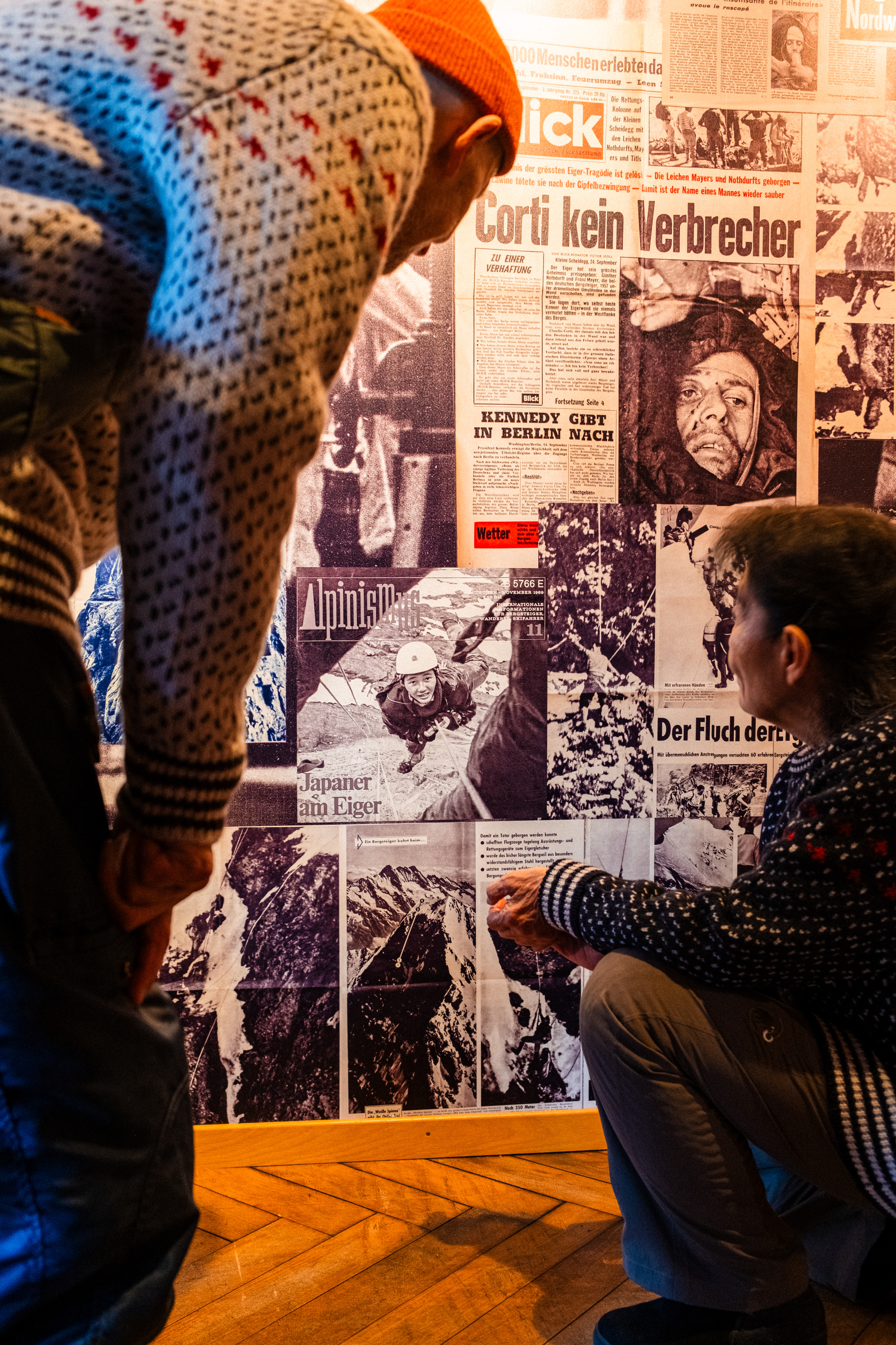 Michiko Imai and Nigel Cabourn looking at a photo from 1969 when Michiko was climbing the Direttissima.